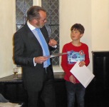 David Weeks presenting prize to Alex Meller,
                      third in 11 and Under Category